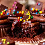 Bite missing from cosmic brownie cupcakes.