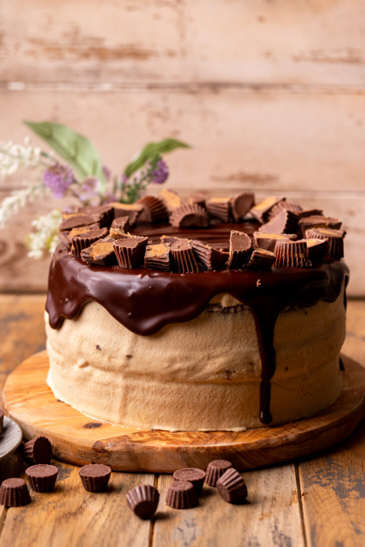 Decorated cake on a wood board.