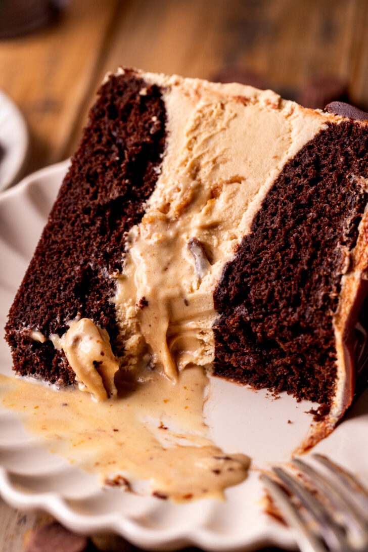 Bite missing from the slie of cake.