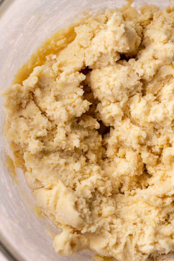 Lemon sugar cookie dough in a bowl.