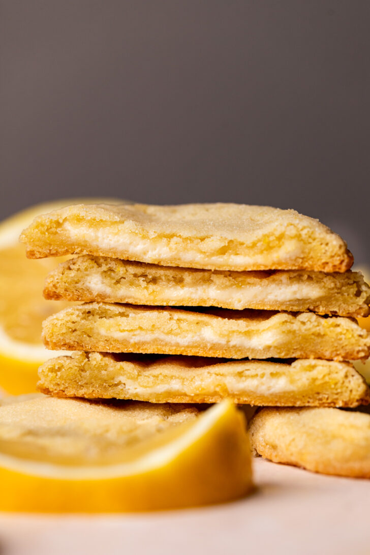 Stack of lemon cheesecake cookies split in half.