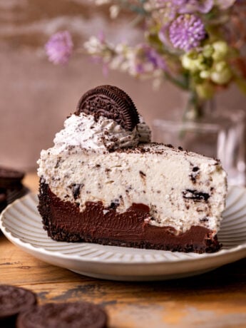 A slice of no bake Oreo pie on a plate.
