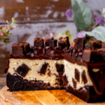 Side view of opened brownie filled cheesecake.