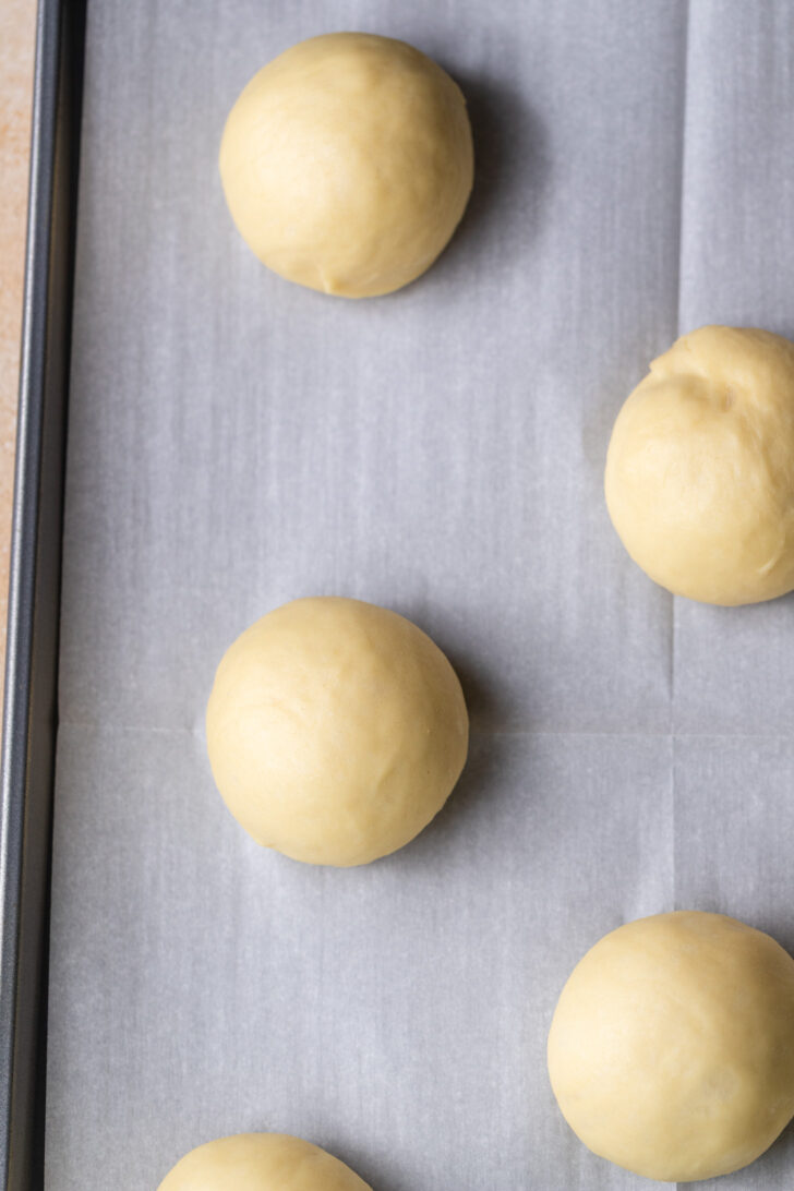 Dough balls on a cookie sheet.