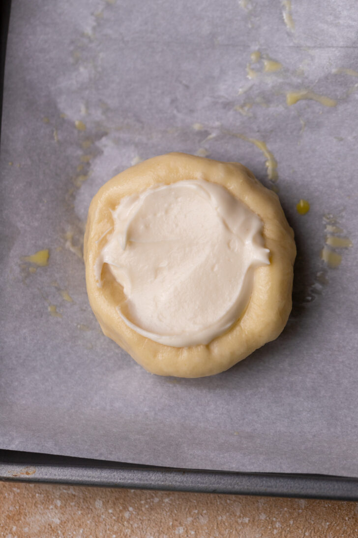 Cheesecake filling in the dough ball.