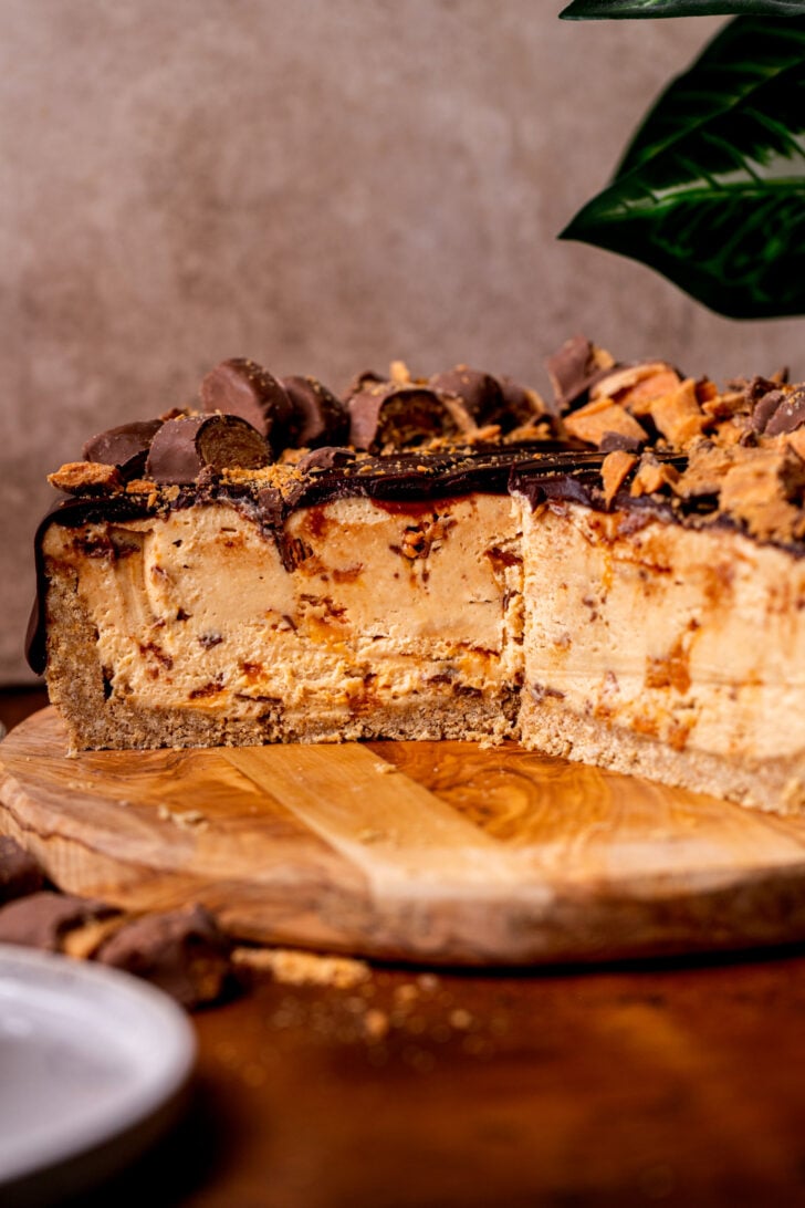 Side view of pie on a wood board.