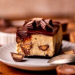 One slice of peanut butter cheesecake bar on a plate.