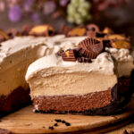 Close up of one slice of chocolate peanut butter pie.