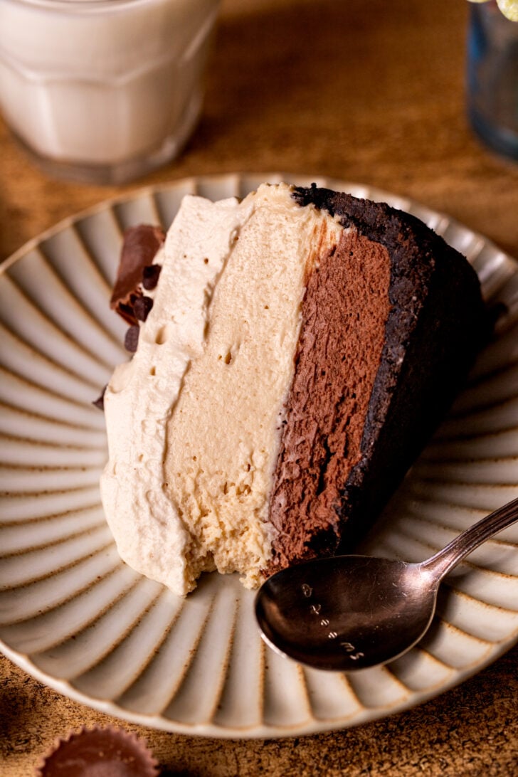 Slice of pie on its side on a plate.