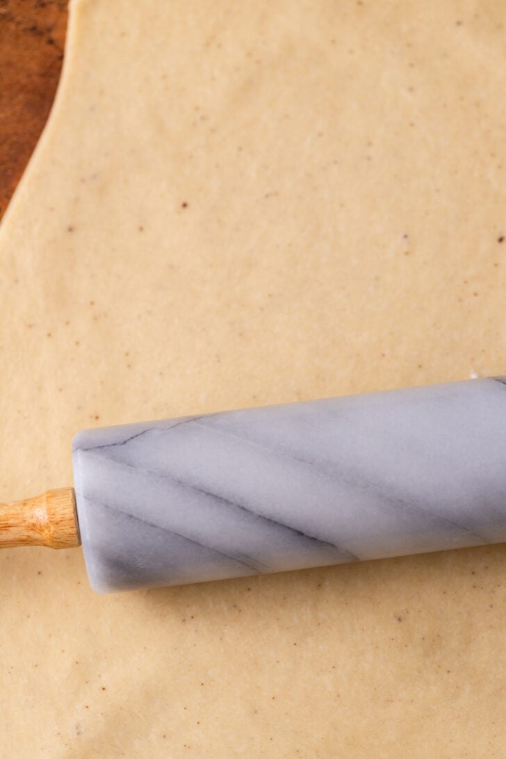 Rolling out the dough.