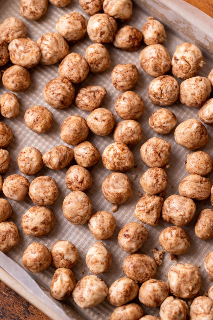 Cookie dough balls on a cookie sheet.