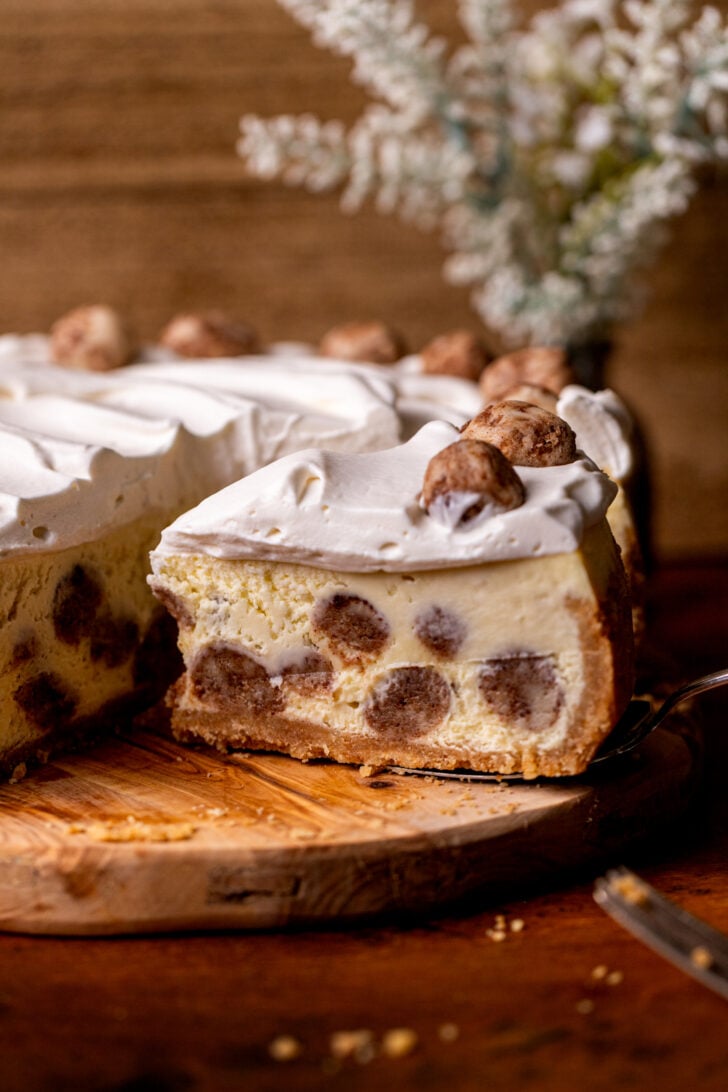 Slice removed from snickerdoodle cheesecake.