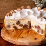 Snickerdoodle cheesecake on a wood board split open.