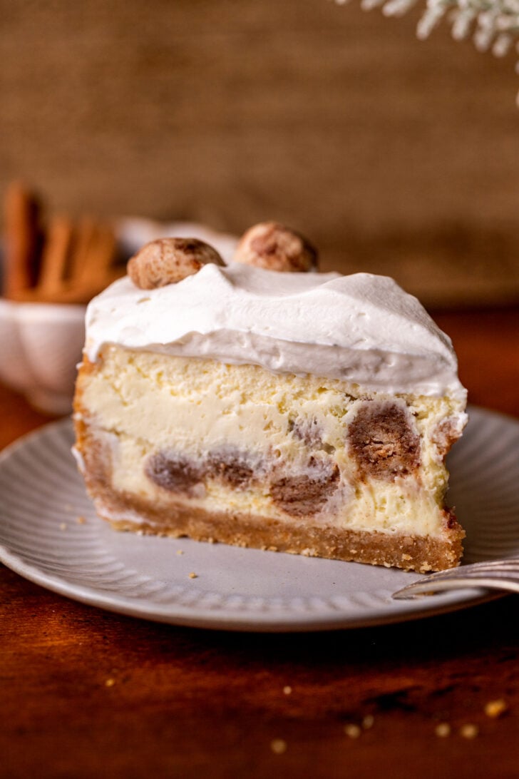 One slice of cheesecake on a plate.