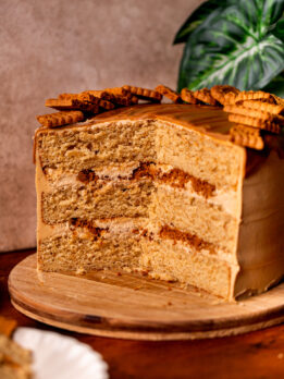 Open Biscoff cookie butter cake on a wood board.