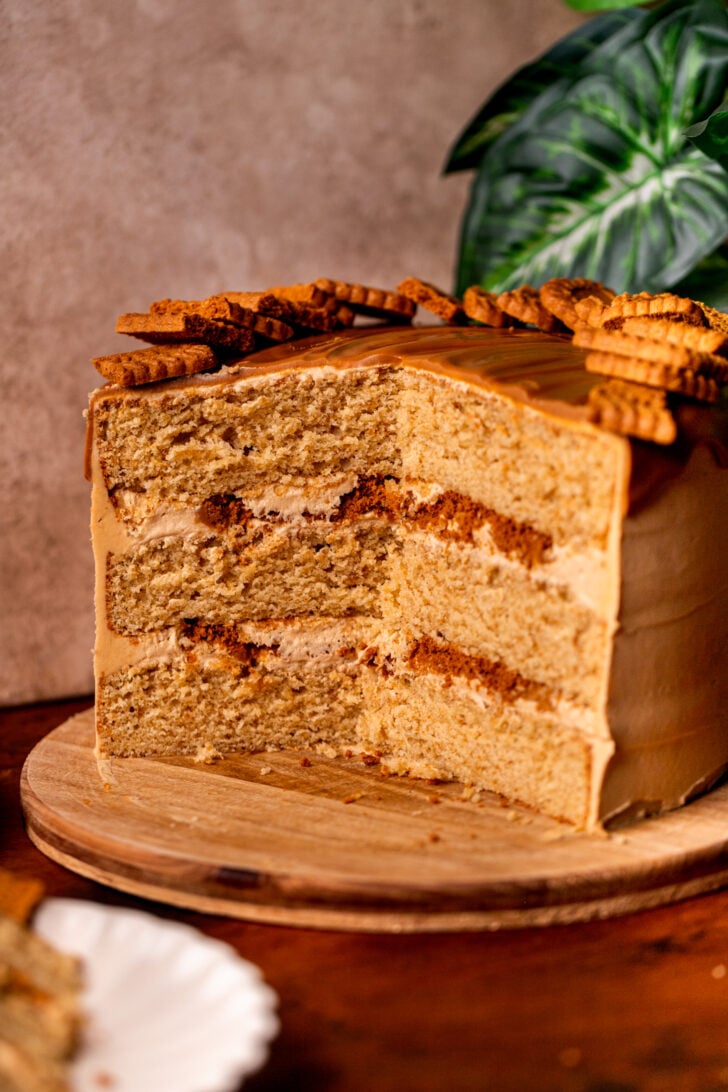 Open Biscoff cookie butter cake on a wood board.