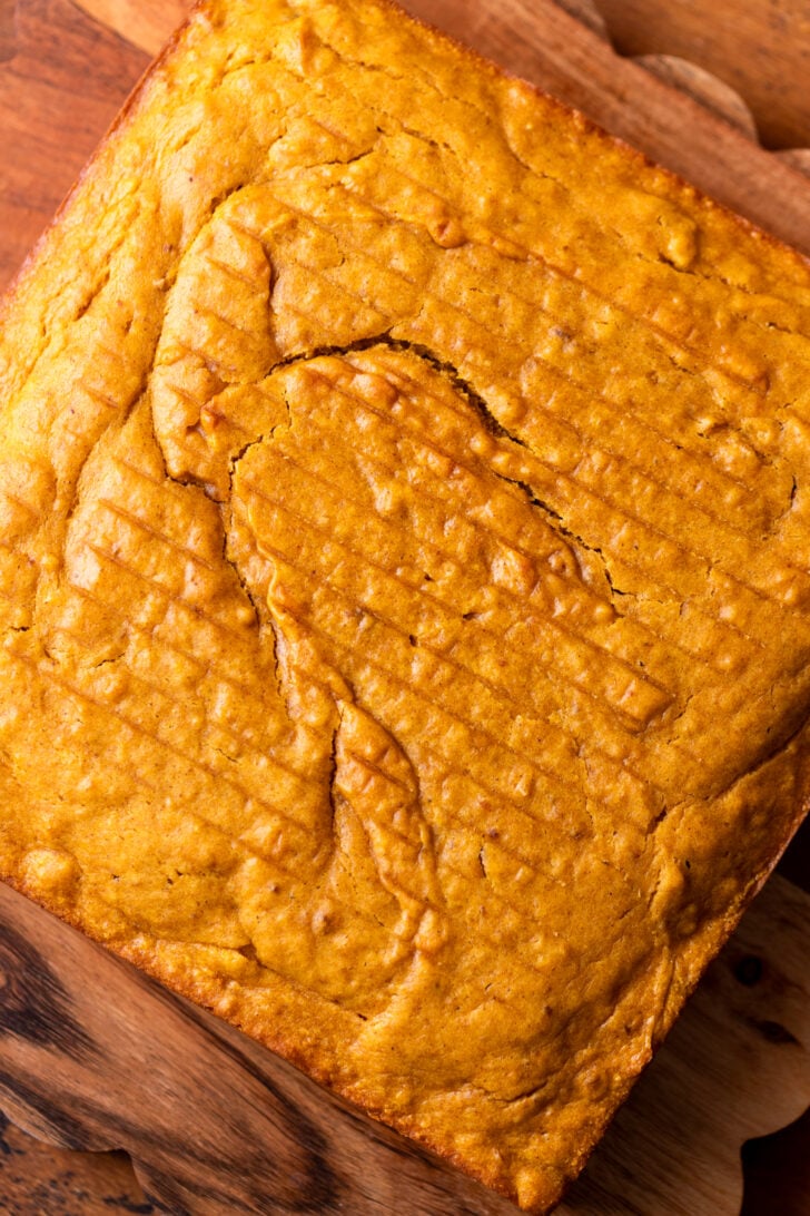 Baked cake on a wood board.