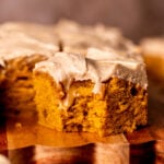 Bite missing from a slice of pumpkin spice latte cake.