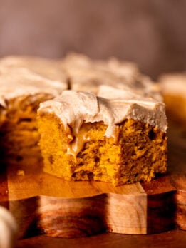 Bite missing from a slice of pumpkin spice latte cake.