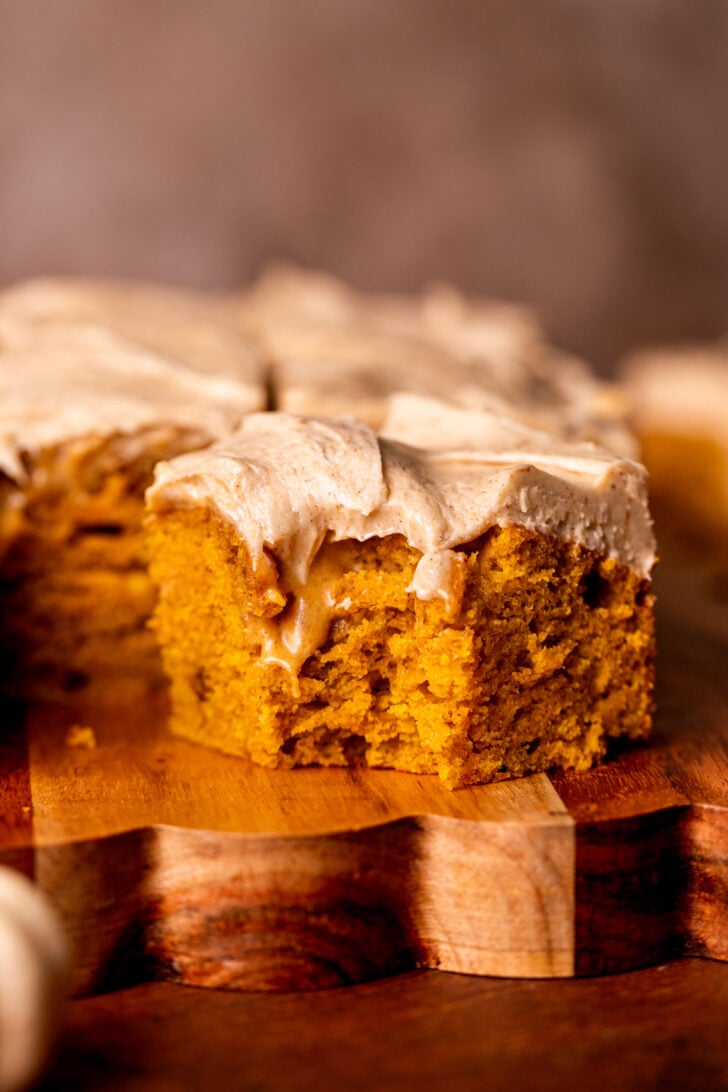 Bite missing from a slice of pumpkin spice latte cake.
