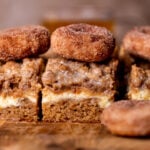 Apple cider coffee cake side view on a wood board.