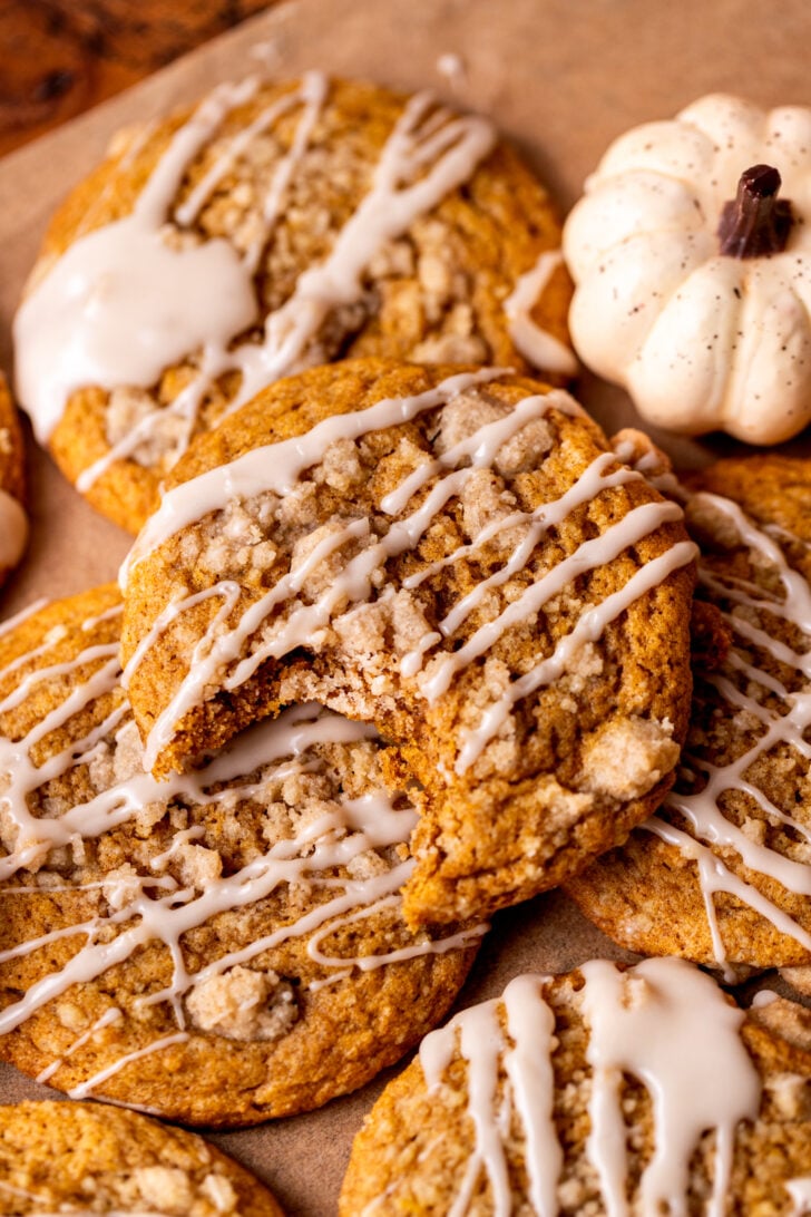 A bite missing from pumpkin coffee cake cookies.