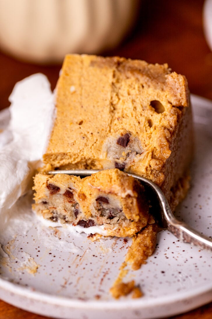 Close up of a cheesecake slice on a plate.