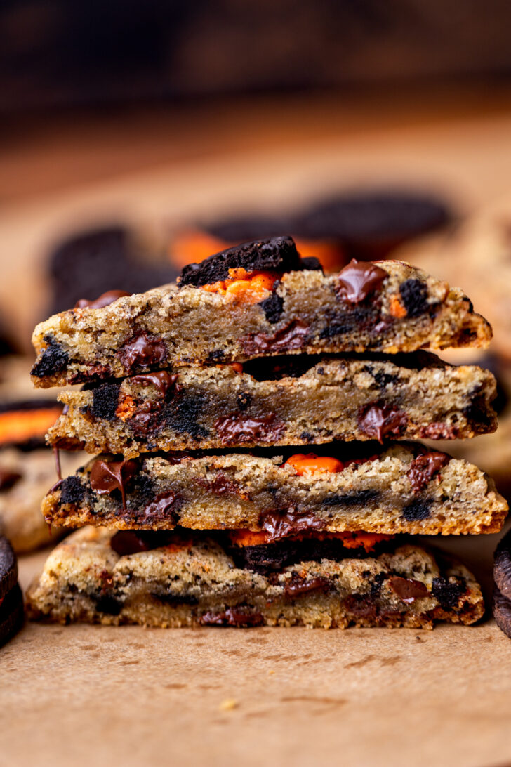 Stack of two Halloween Oreo cookies split in half.