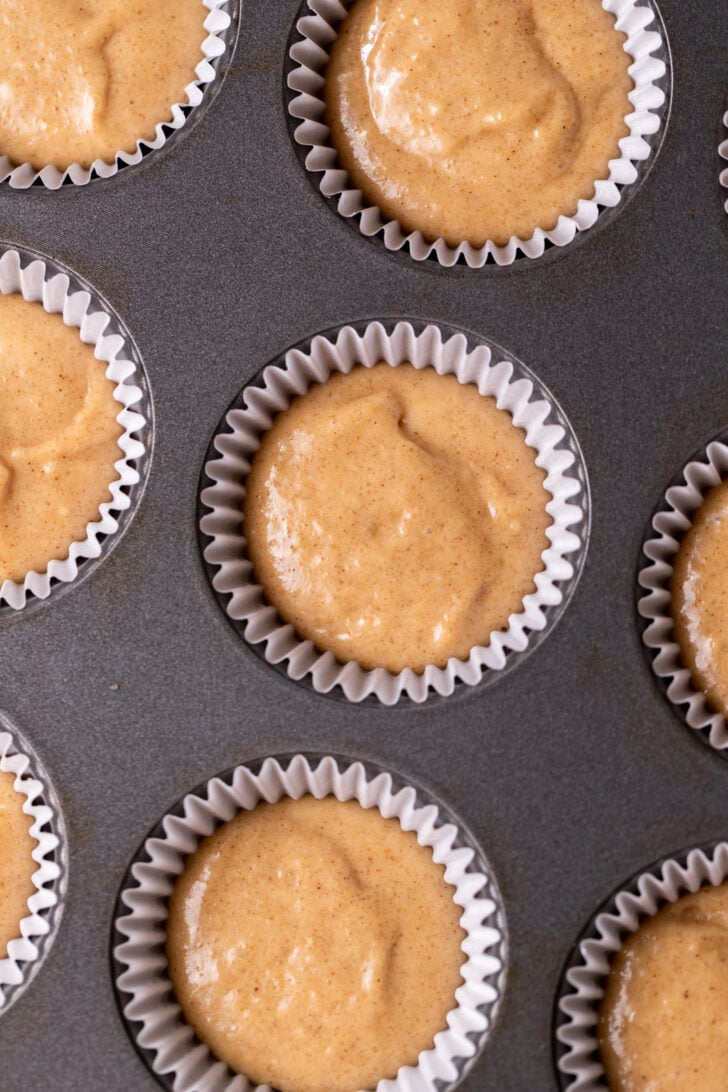 Apple cider batter in the cupcake pan.