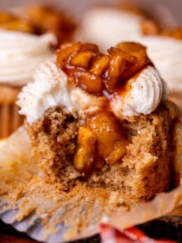 Bite missing from apple pie cupcakes.