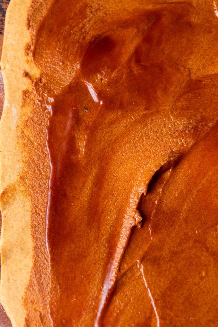 Caramel spread on the dough.