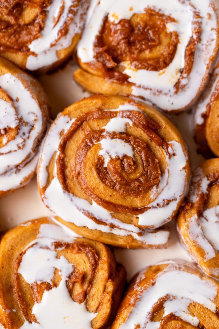Raw cinnamon rolls with heavy cream on top.