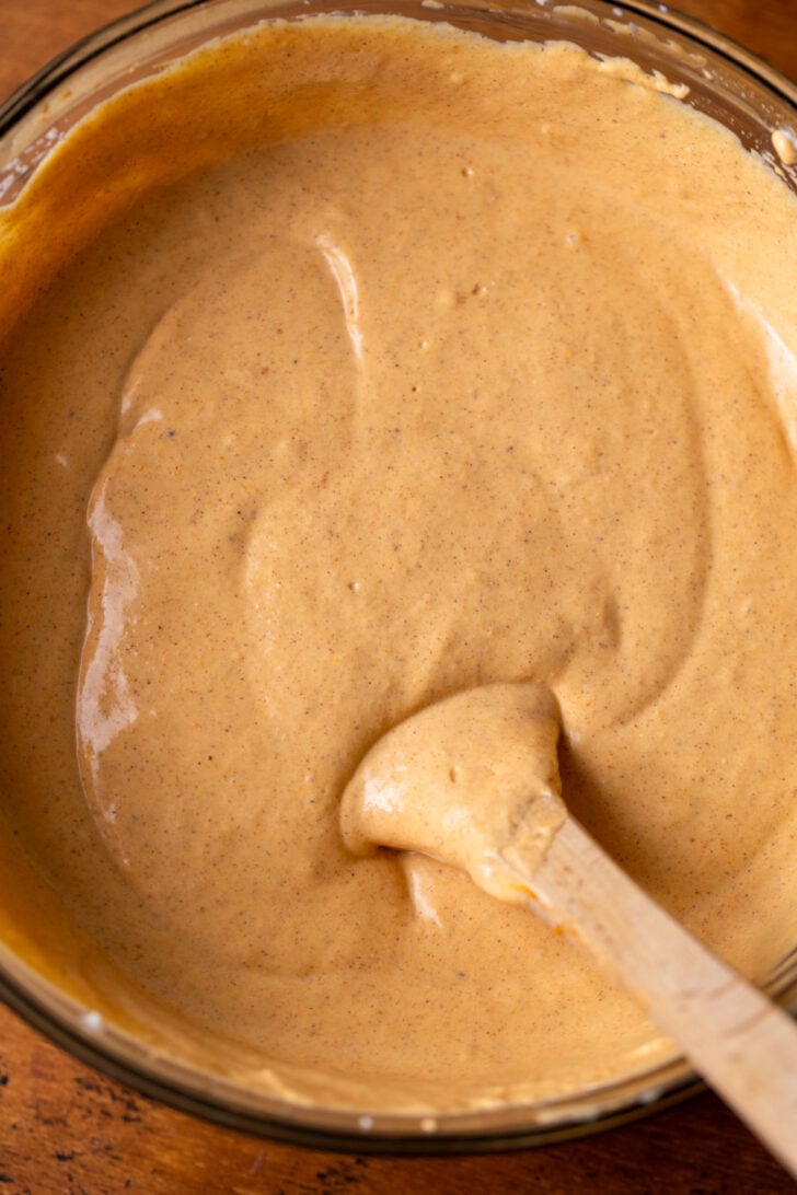 Pumpkin cheesecake batter in a bowl.