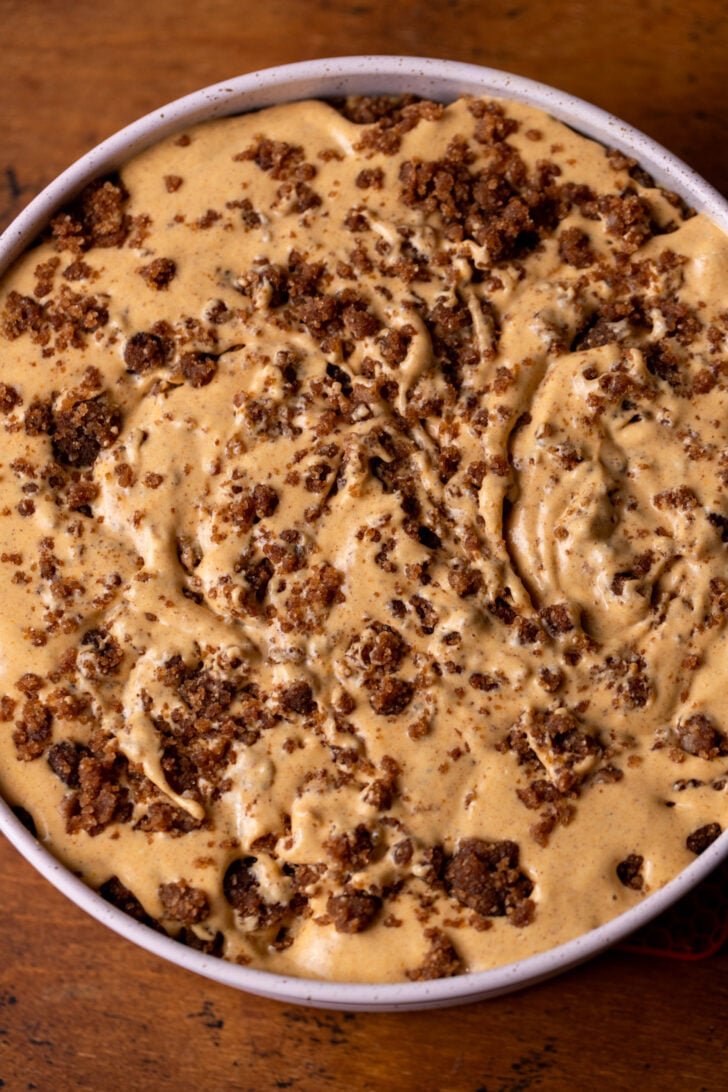 Top view of pumpkin batter with cinnamon swirled in.