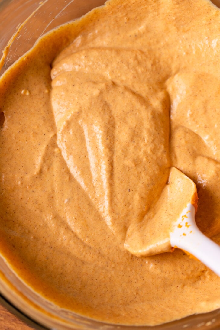 Pumpkin cheesecake batter in a bowl.