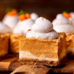 Side view of pumpkin cheesecake bars.