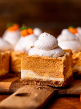 Side view of pumpkin cheesecake bars.