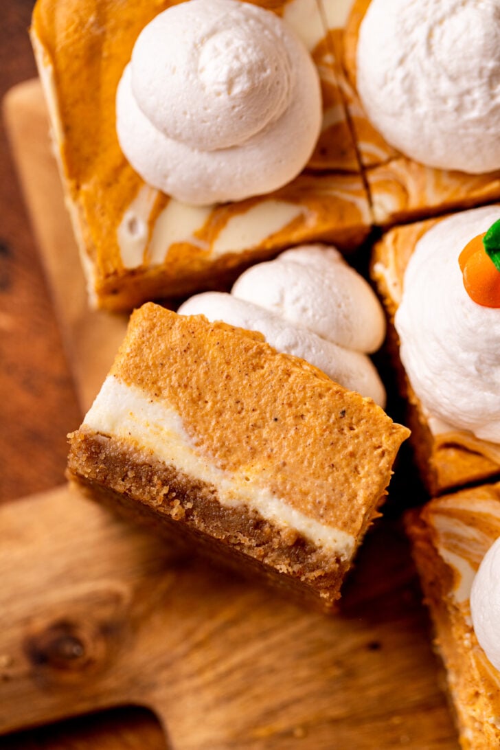 Top view of one slice of pumpkin cheesecake bar.