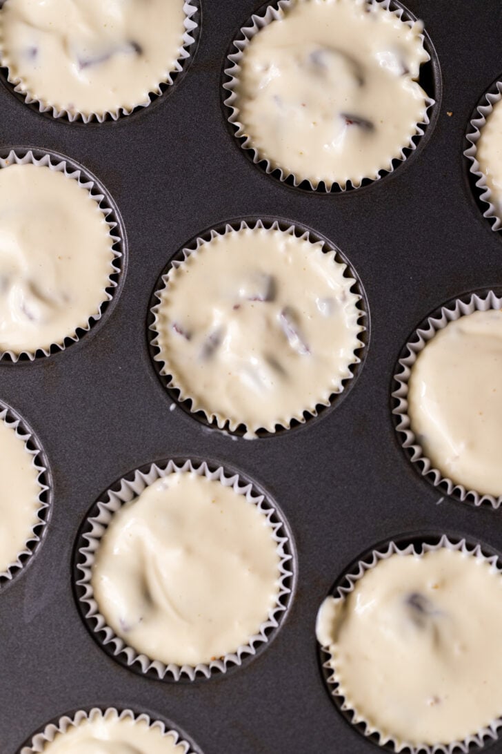 Cheesecake batter in a muffin pan.