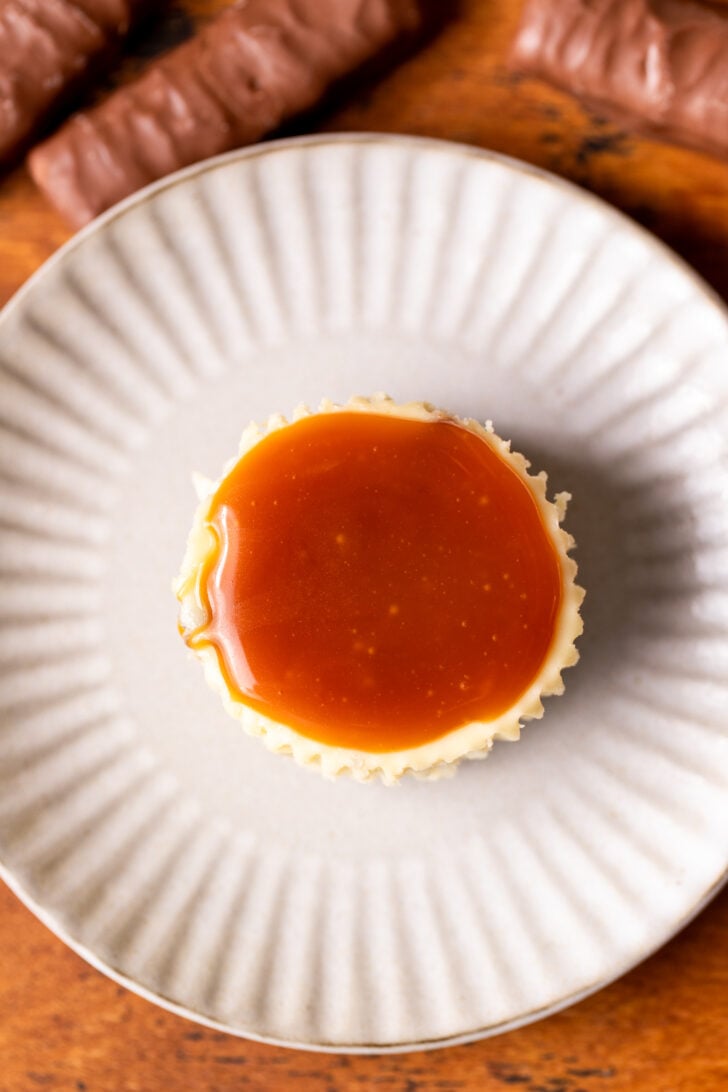 Caramel on top of a cheesecake.