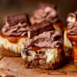 Bite missing from Twix mini cheesecakes.