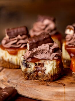 Bite missing from Twix mini cheesecakes.