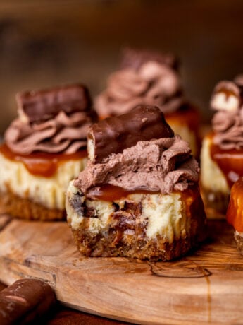 Bite missing from Twix mini cheesecakes.